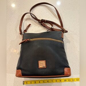 Dooney & Bourke Pebble Grain Crossbody bag in black with tan/brown trim